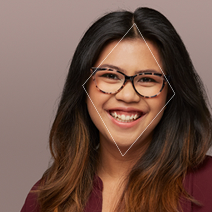 Woman wearing dark-rimmed glasses with a diamond overlay on her face, showcasing the glasses' fit and design.