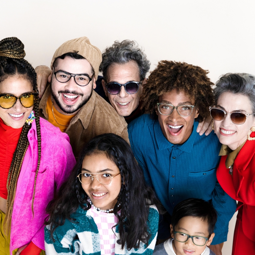 Group of people wearing various stylish eyeglasses and sunglasses.
