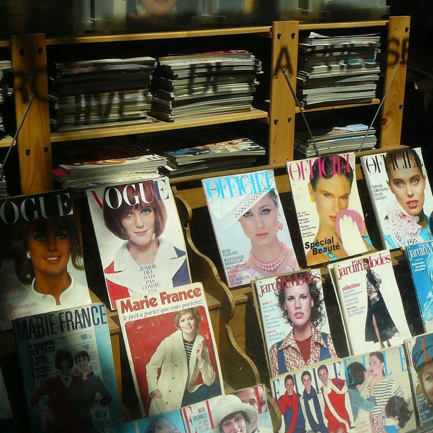 Magazines on display including Vogue, L