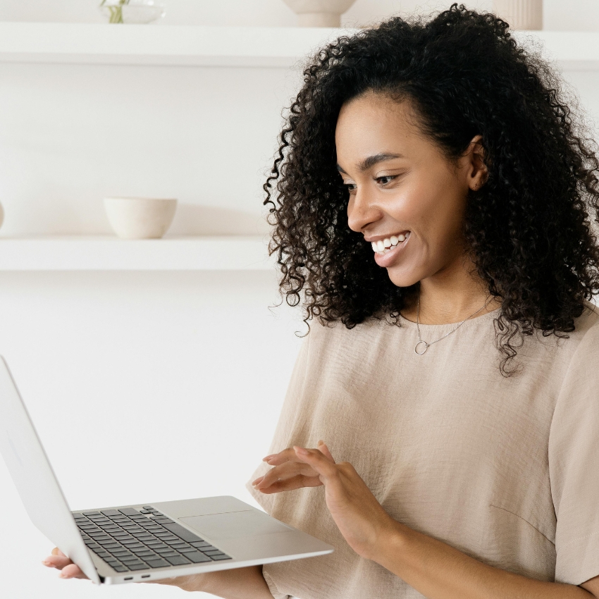 Person using a silver laptop.